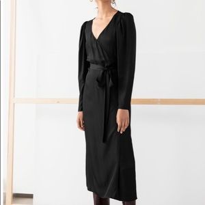 Black Wrap Midi dress with dramatic sleeves.